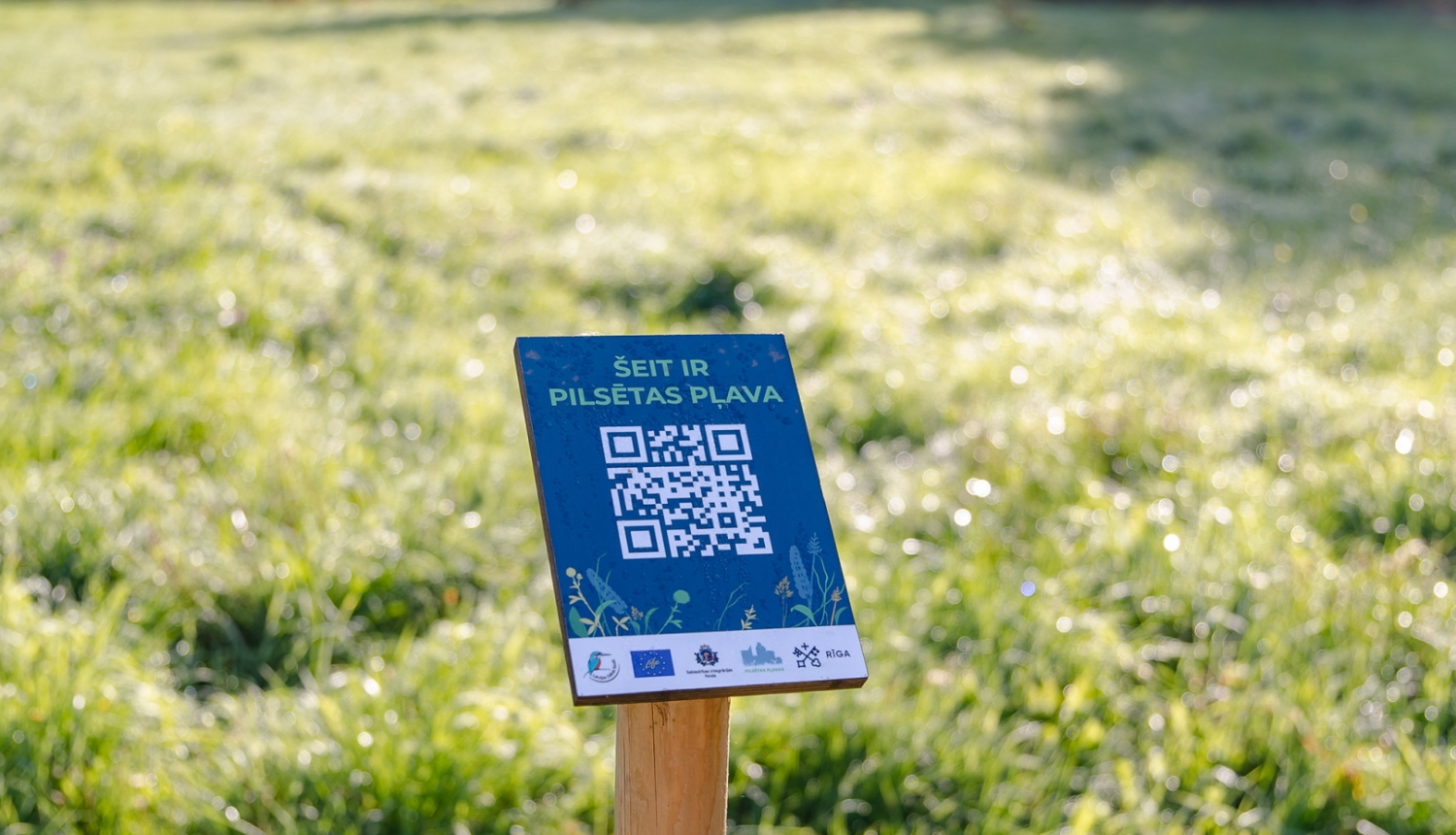 Uzraksts Pilsētas pļava